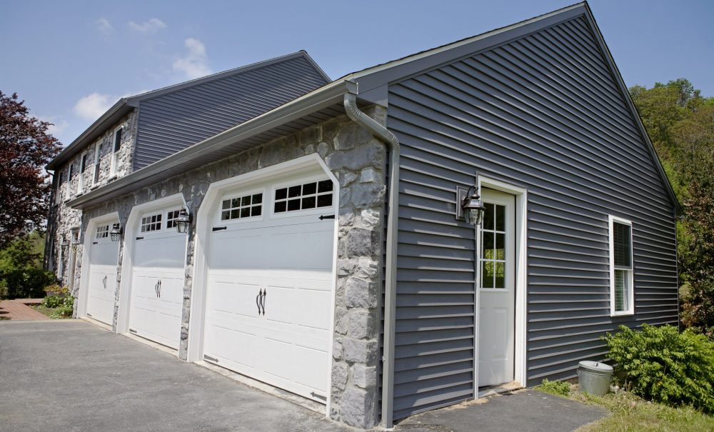 stone and vinyl garage restored after fire